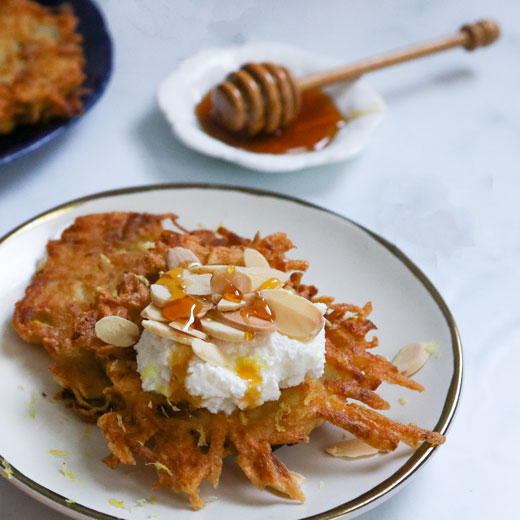 Latkes topped with Ricotta, Almonds and Honey