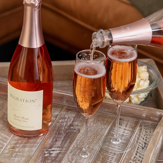 Migration Sparkling Wine being poured in two glasses